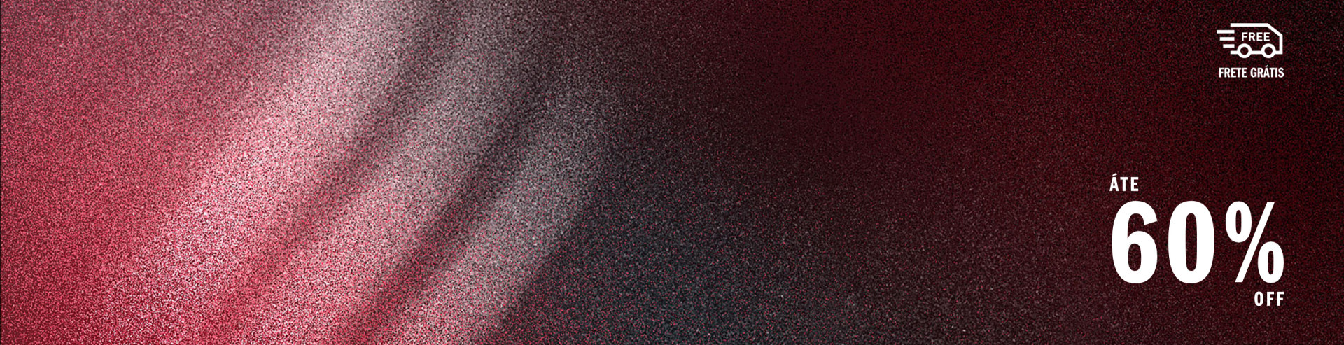 The image appears to be a close-up view of a textured, dark-colored fabric or material, with a subtle gradient of pink or reddish hues visible in the background.