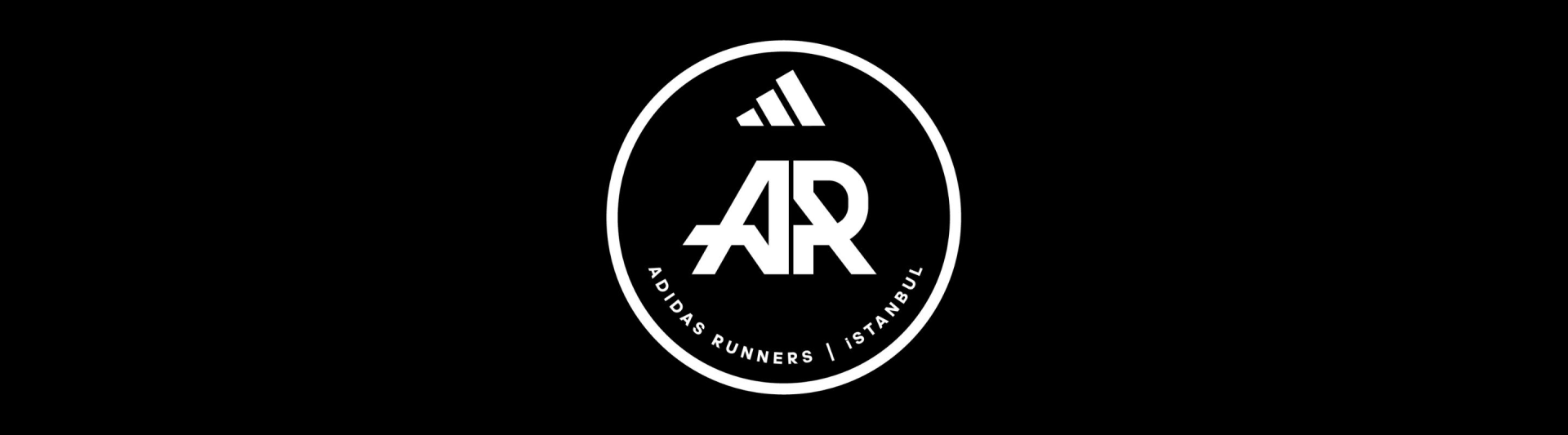 A black and white oval-shaped logo with the letters "AR" and the text "ADIDAS RUNNERS ISTANBUL" displayed prominently against a dark background.
