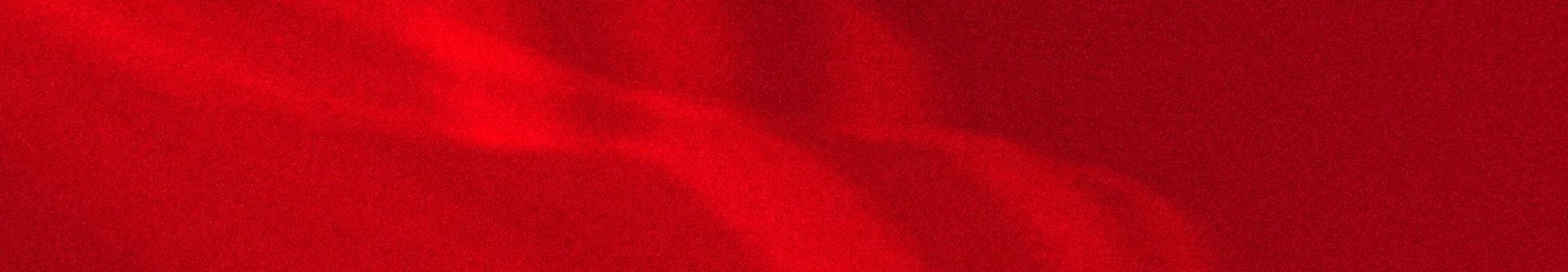 A vibrant, solid red background fills the entire frame, creating a bold and striking visual.