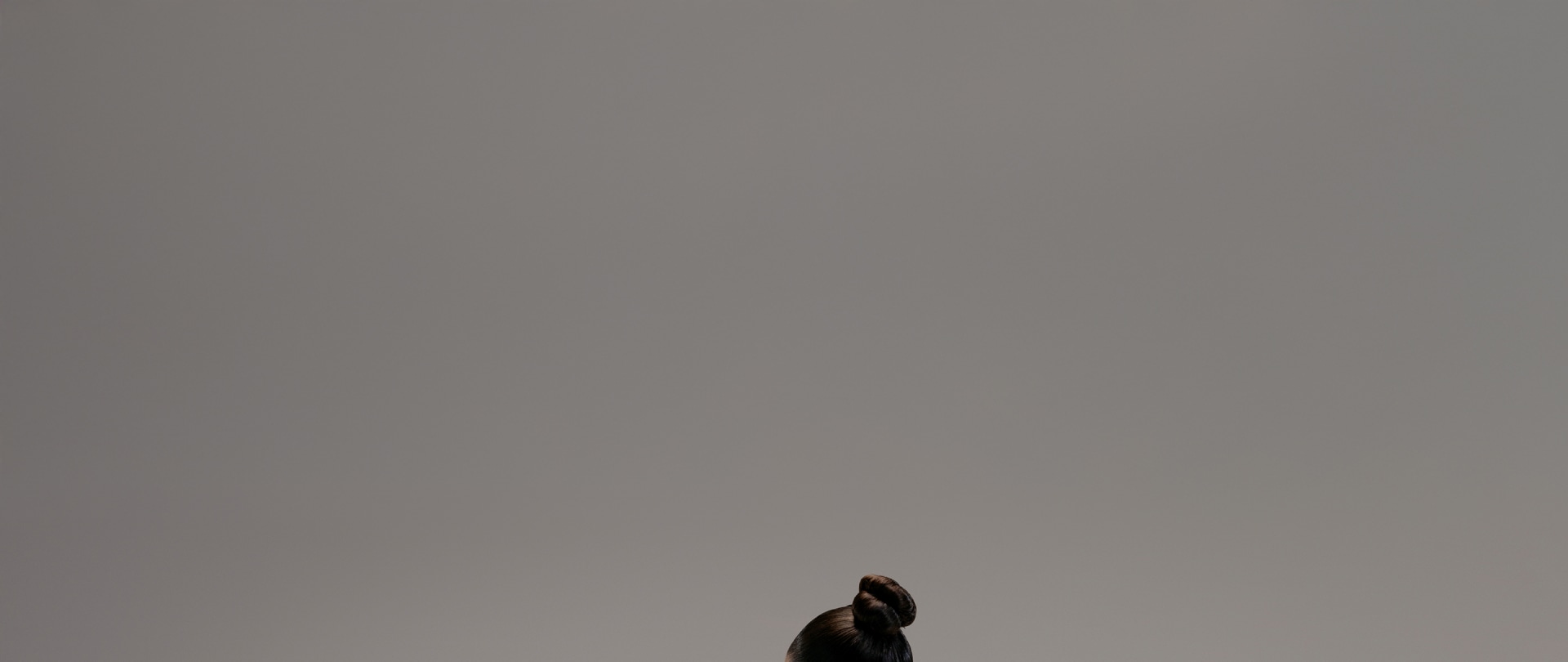 Woman wearing TECHFIT bra lifts a heavy tyre.