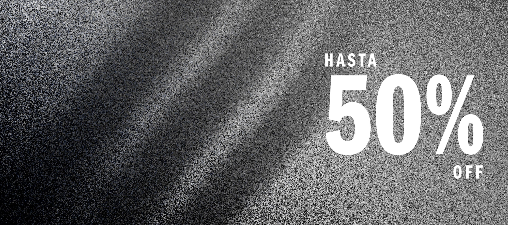 The image displays a large white text reading "HASTA 50%" against a grainy, black and white background, suggesting a promotional or sale-related advertisement.