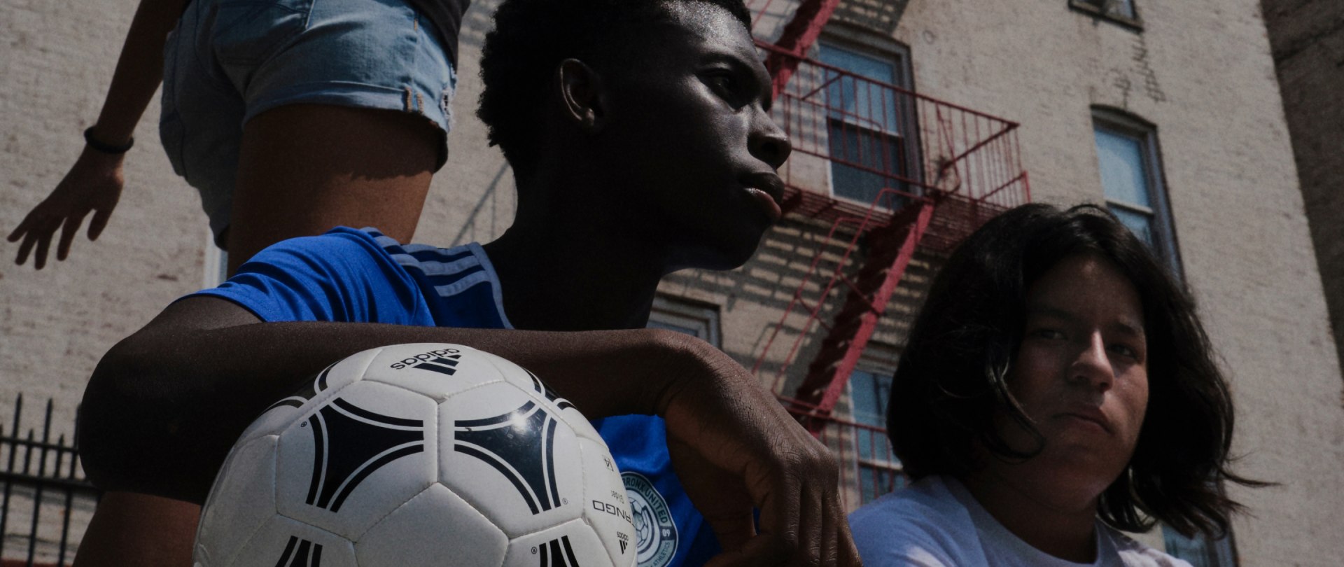 Boy holding an adidas ball
