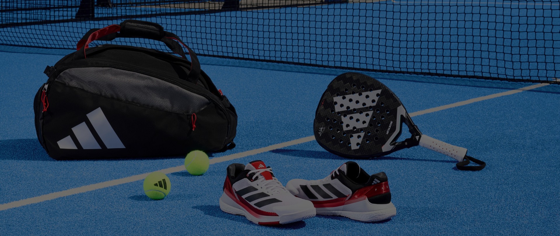 A tennis court with a net, a backpack, and various tennis equipment such as rackets and balls are visible in the foreground.