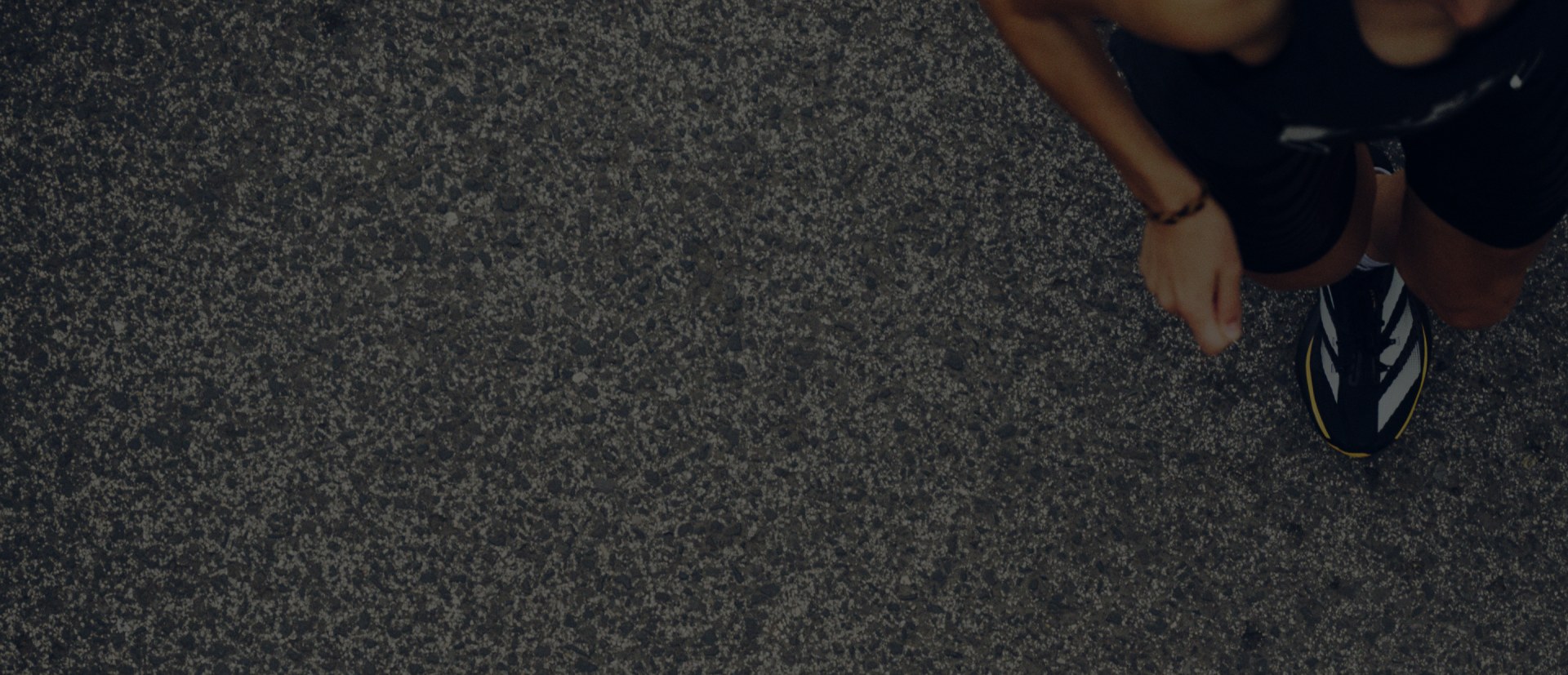close up of ground and adizero shoe