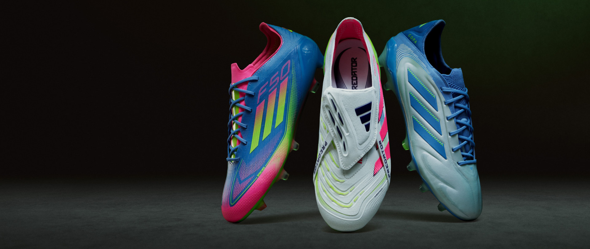 The image features a vibrant and colorful pair of soccer cleats or football boots against a dark background, showcasing their unique and eye-catching design.