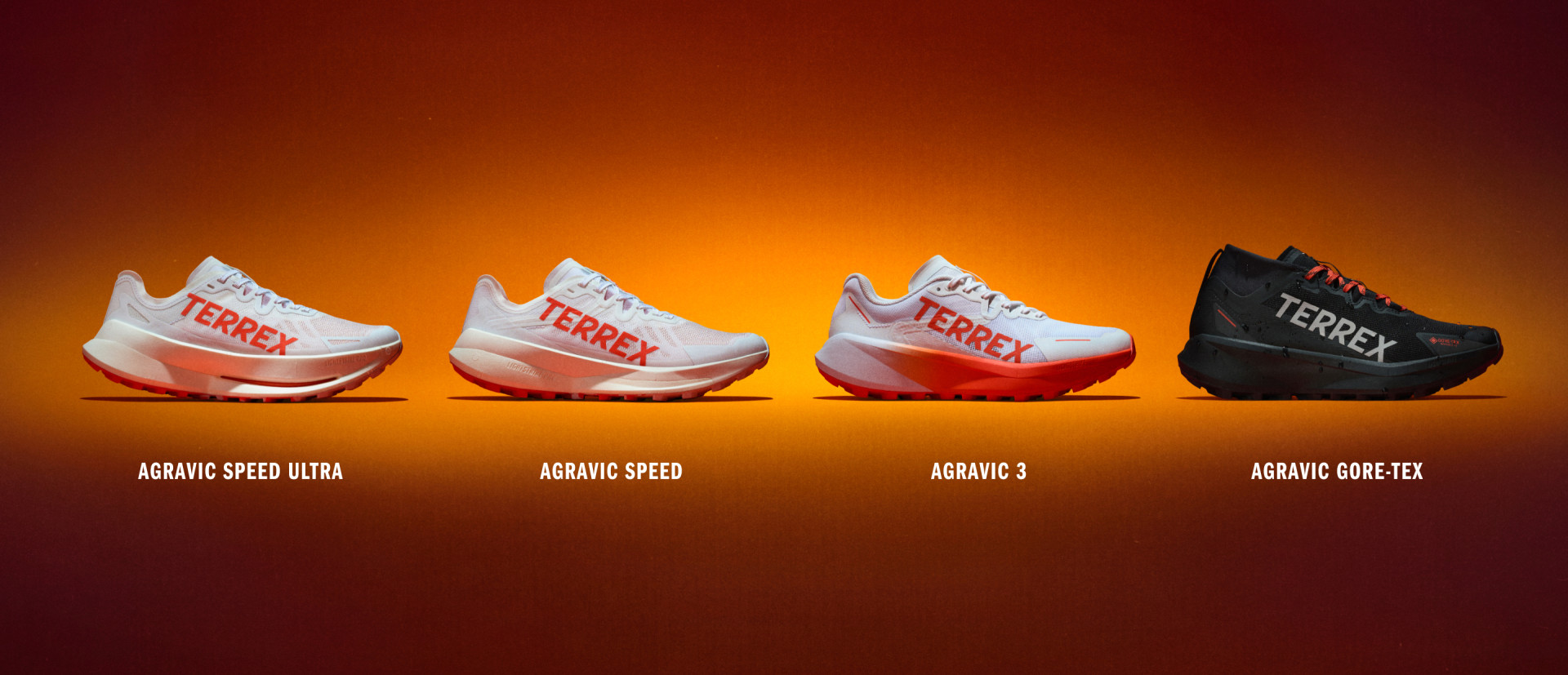 Four different adidas Agravic trail running shoes in a row, against an orange backdrop.