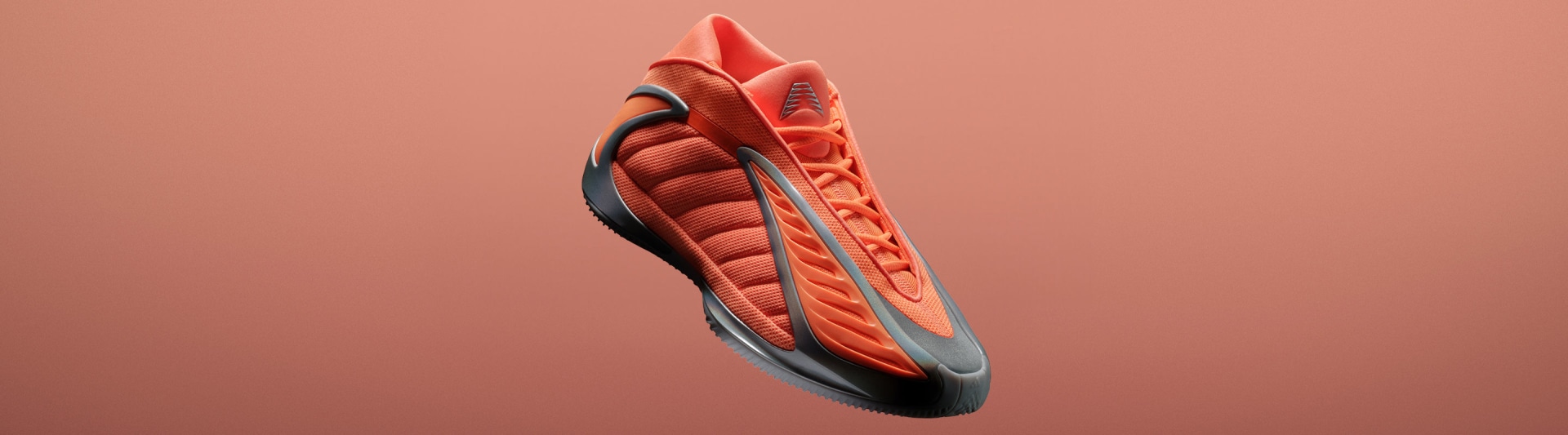 An orange and grey adidas Anthony Edwards 2 basketball sneaker shown angled against a orange background. It has a sculpted sole and wave-like side design.