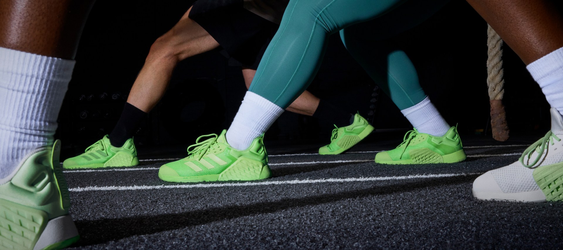 A close-up of adidas Dropset 3 strength training shoes during a gym workout.
