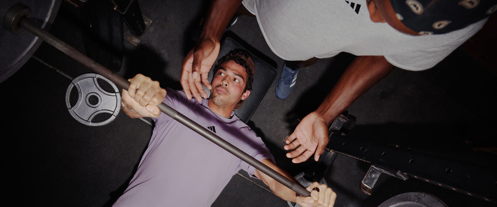 Group shot of men working out doing chest press wearing D4T collection.