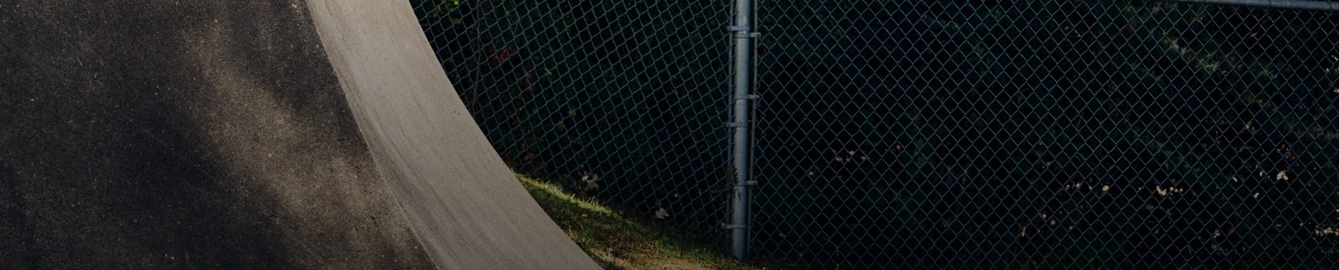 Mark Gonzales skates on a ramp in a light blue adidas x Mark Gonzales jacket and black pants, wearing white adidas Aloha Super "Places" sneakers.