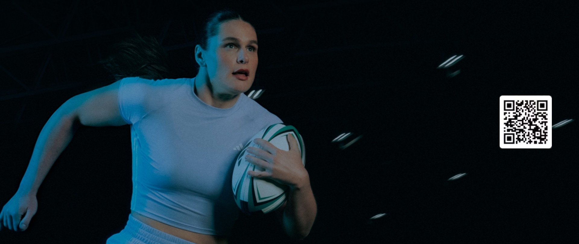 US rugby player Ilona Maher running while holding a rugby ball