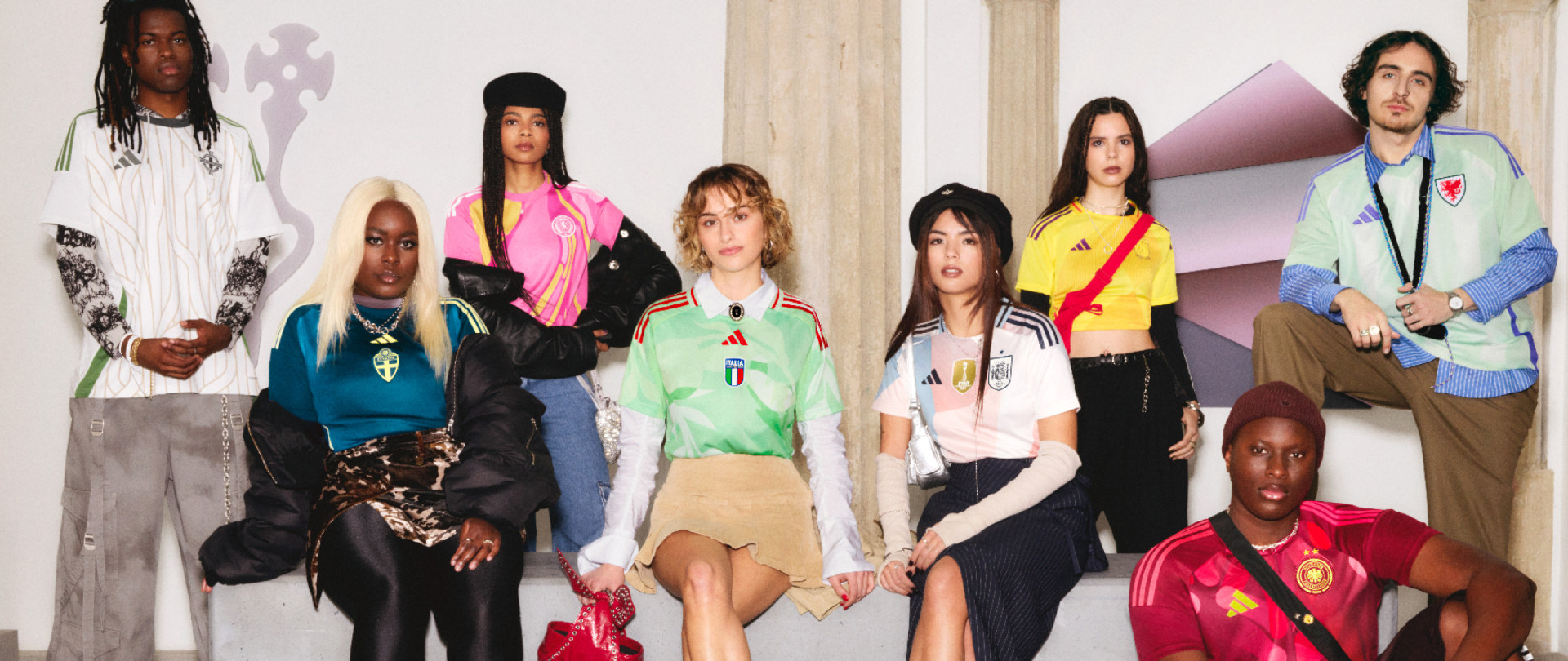 A group of diverse individuals, including people of different ages, genders, and ethnicities, are standing together in a colorful and vibrant setting.