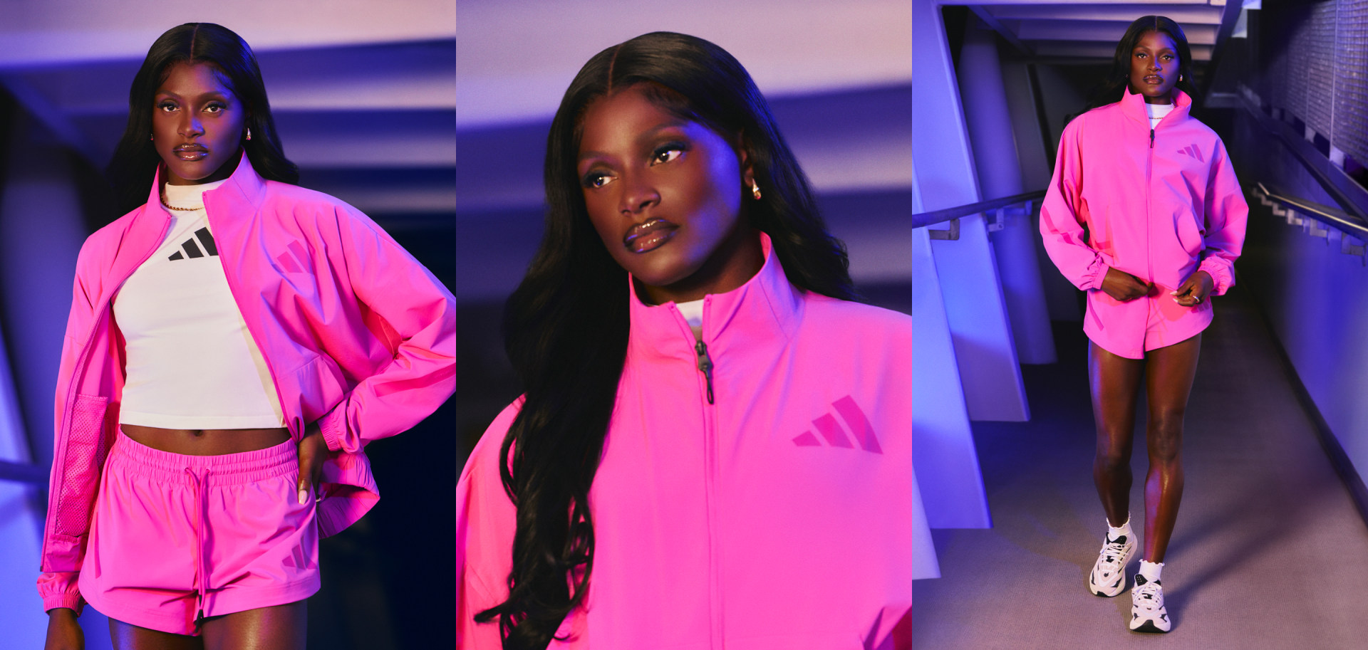 The image features a person wearing a bright pink outfit, including a jacket and shorts, standing in a dimly lit setting with a purple-toned background.