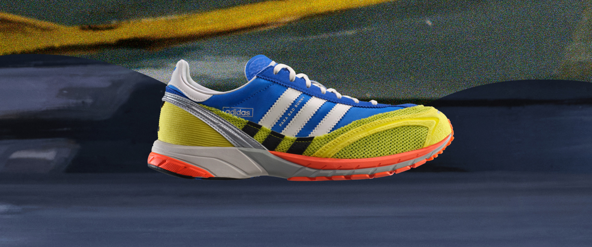 Side profile of blue, yellow and red running shoe.