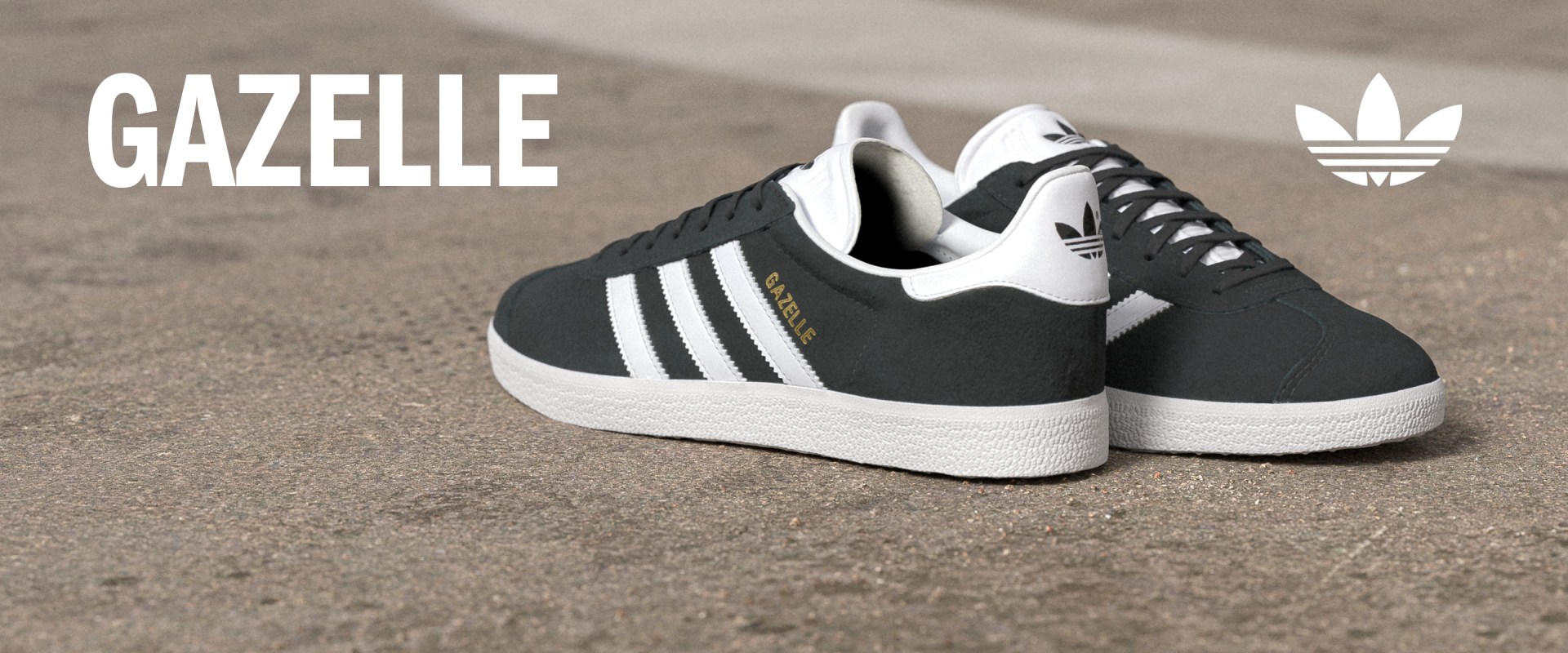 A pair of black and white Adidas Gazelle sneakers resting on a textured surface, with the Adidas logo prominently displayed.