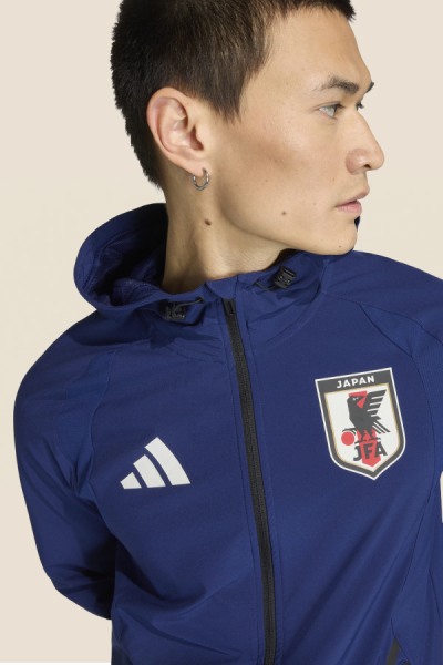 Image of a man wearing a track top