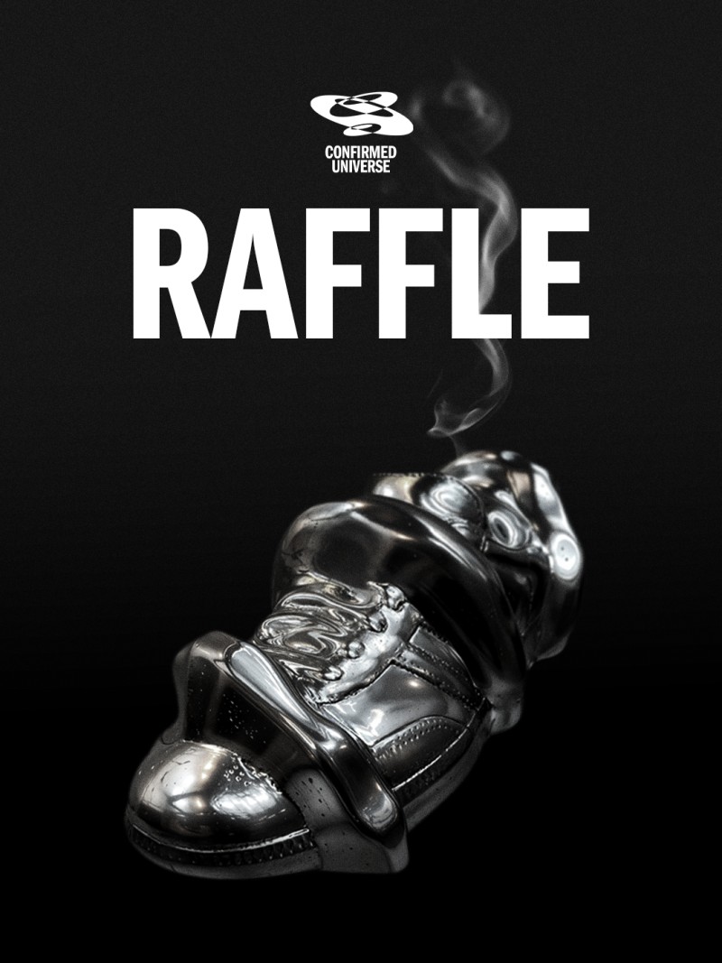 A black and white image featuring a close-up of a hand holding a smoking cigar, with the word "RAFFLE" prominently displayed in the background.