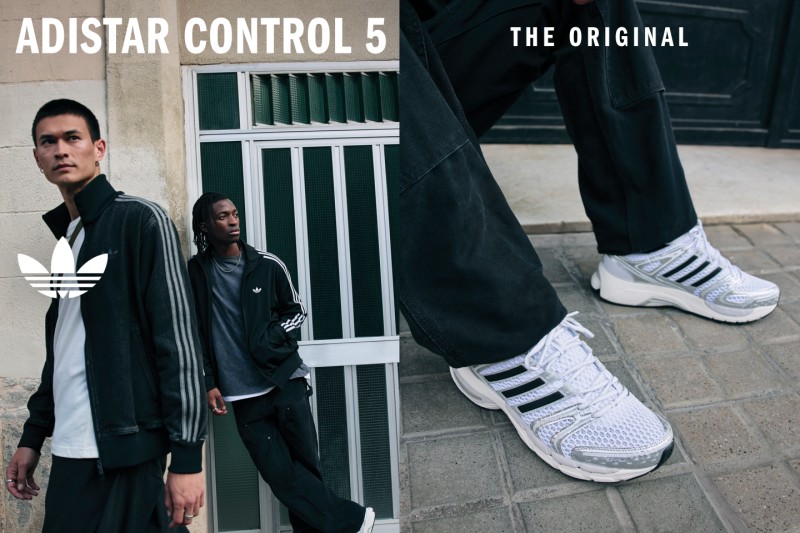The image features two individuals standing in front of an Adidas Control 5 storefront, with one person wearing a black coat and the other wearing Adidas sneakers.