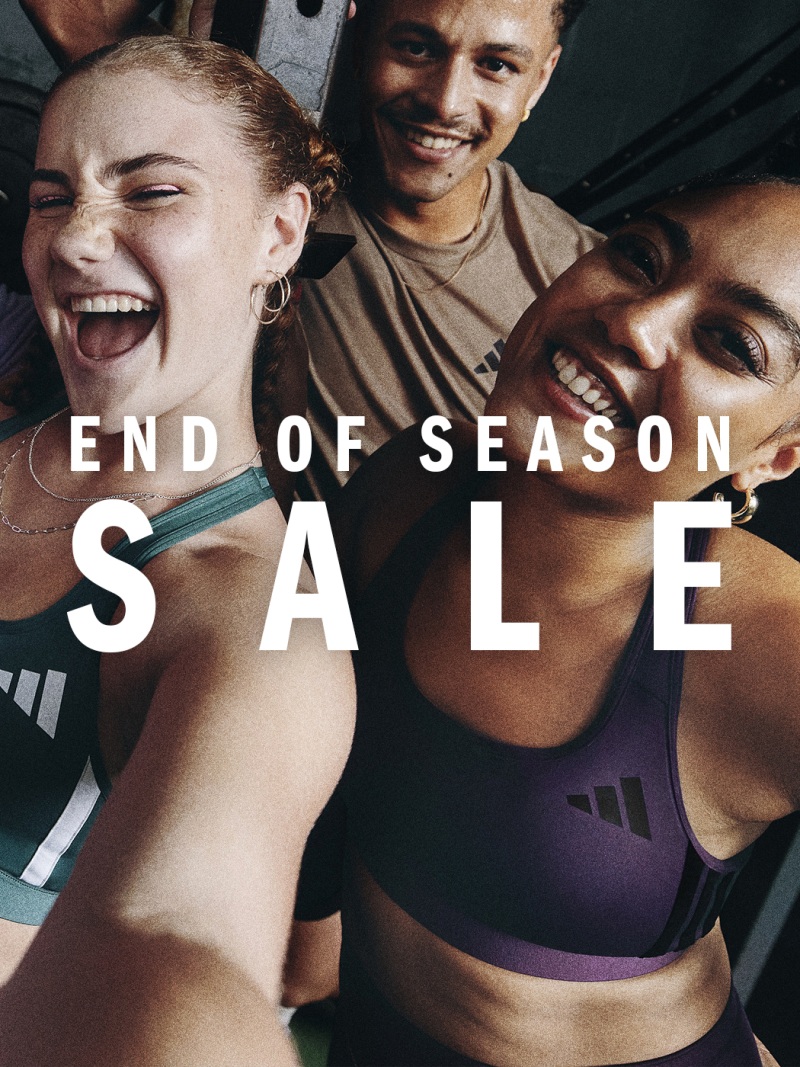 The image features two smiling individuals, a woman and a man, wearing athletic clothing and posing together in what appears to be a promotional or advertising setting for an "End of Season Sale" event.