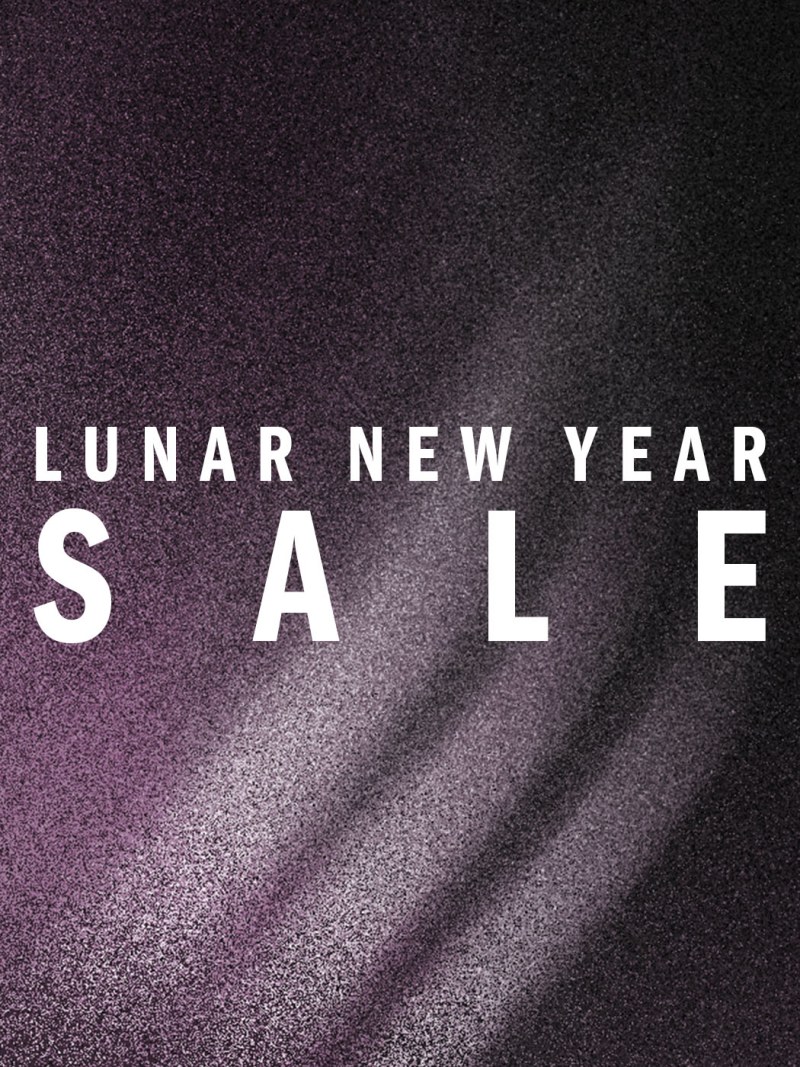 The image displays the text "LUNAR NEW YEAR SALE" against a dark, glittery background.