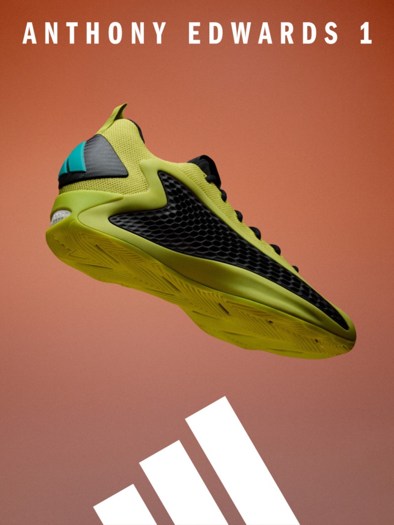 A vibrant, neon-colored athletic shoe with a sleek, futuristic design stands prominently against a warm, orange-tinted background.