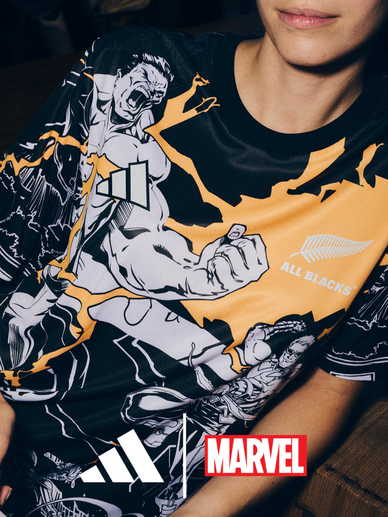 The image features a striking graphic design depicting a muscular, heroic figure in a dynamic action pose against a dark, dramatic background with lightning-like effects.