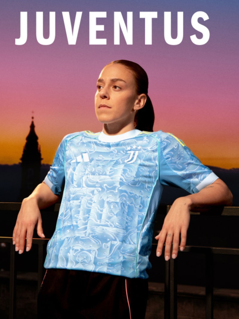 The image depicts a person wearing a light blue Juventus soccer jersey, standing in front of a scenic background with a sunset sky.