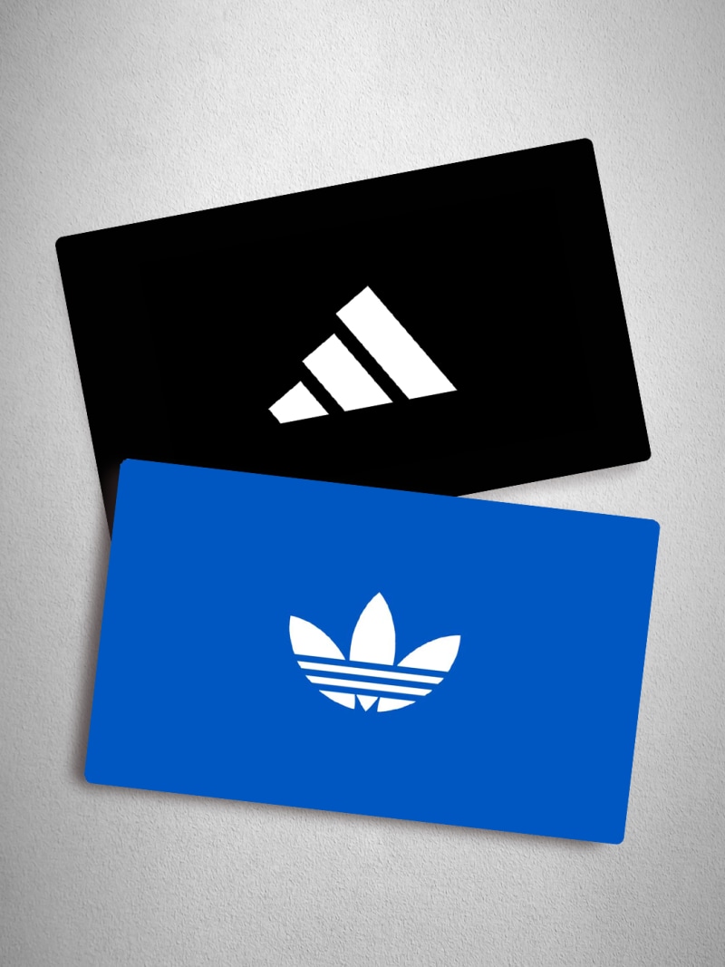 Two rectangular cards, one black with the Adidas logo and one blue with the Adidas Originals logo, are displayed against a light background.