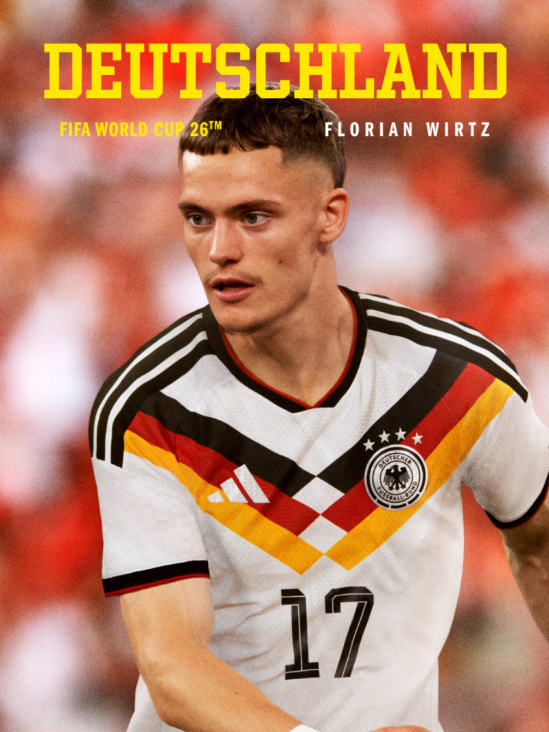 The image features a close-up portrait of a young male soccer player wearing a white and black jersey with the German national team logo, set against a blurred background of a stadium or field.