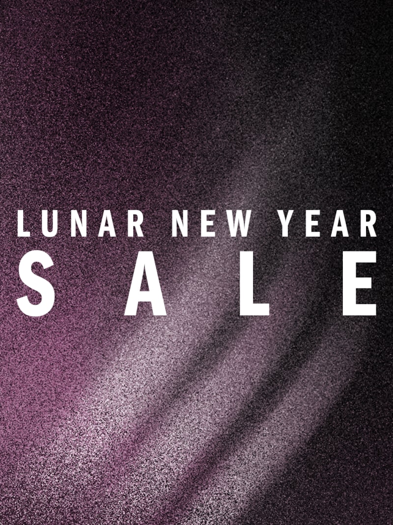 The image displays the text "LUNAR NEW YEAR SALE" against a dark, glittery background.