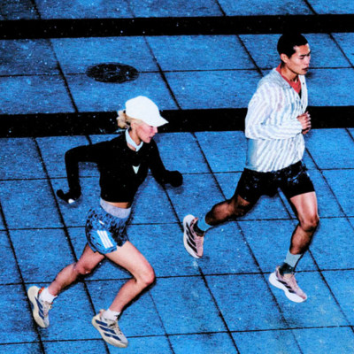 close up of legs of people in black shoes and pink socks