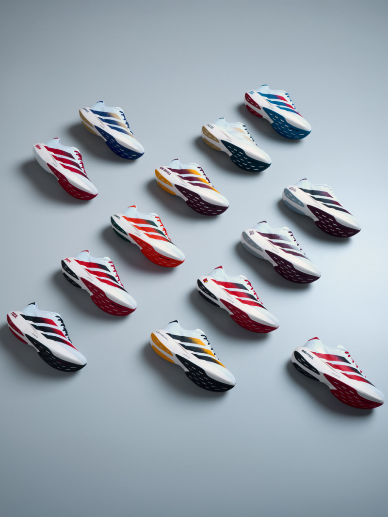 A collection of colorful, sleek speedboat models arranged on a plain gray background.