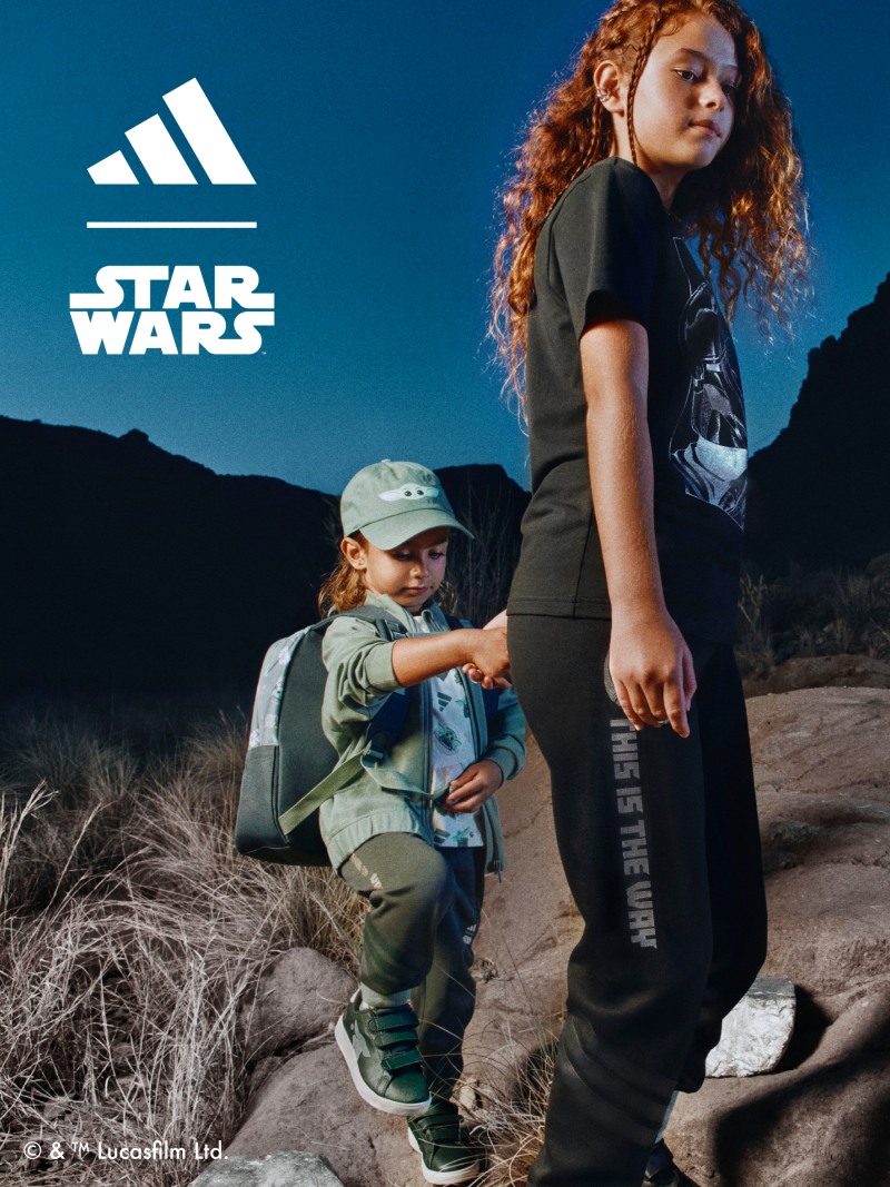 Two children walking across a rock wearing the adidas | Star Wars: The Mandalorian™ collection