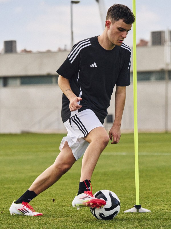 Male player practicing with an adidas ball while wearing F50 boots