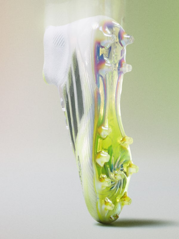 A vibrant, abstract glass sculpture with intricate, swirling patterns and a striking green and yellow color palette, set against a soft, blurred background.
