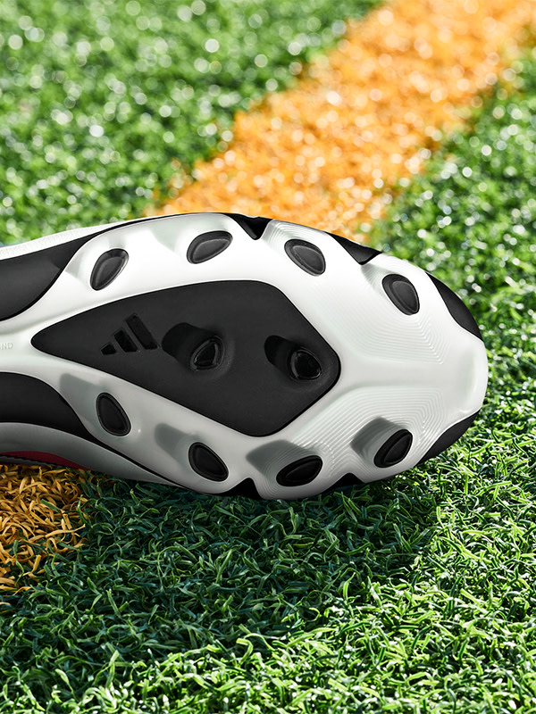 An outsole of an adidas football boot made to be played on multiple surfaces