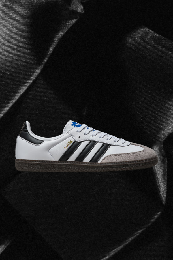 Side view of white Samba adidas sneaker.