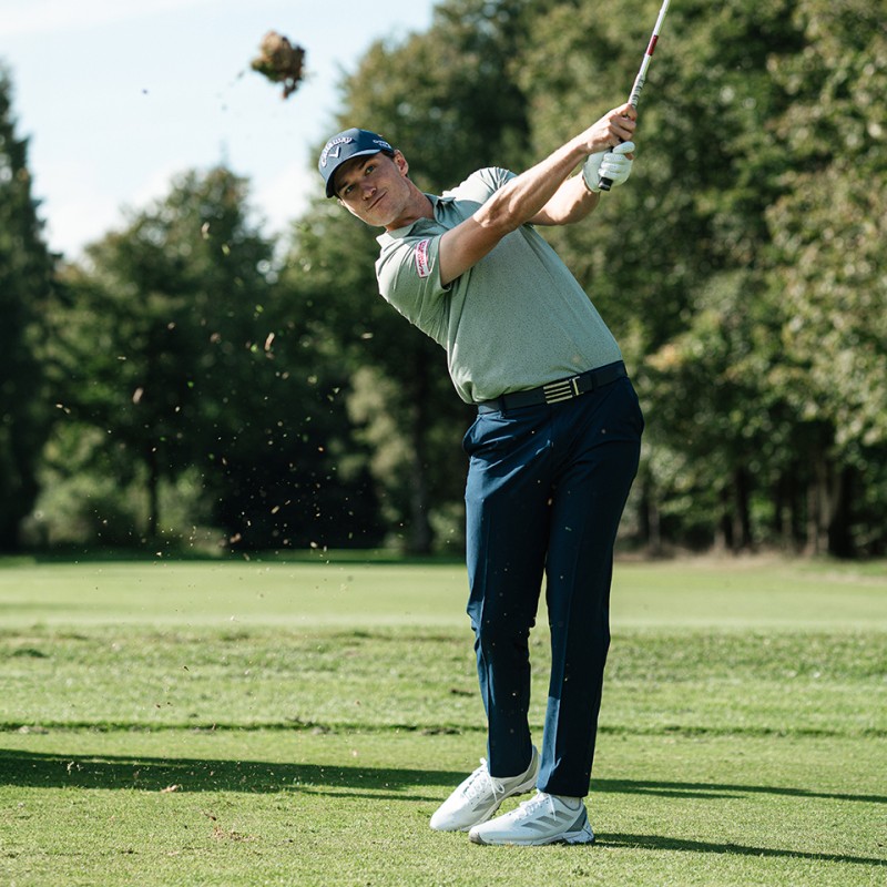 Man on golf course. 