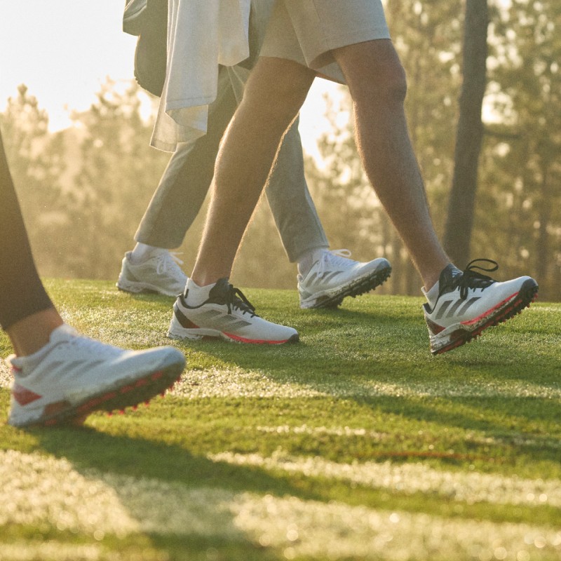 People walking in Adizero ZG golf shoes