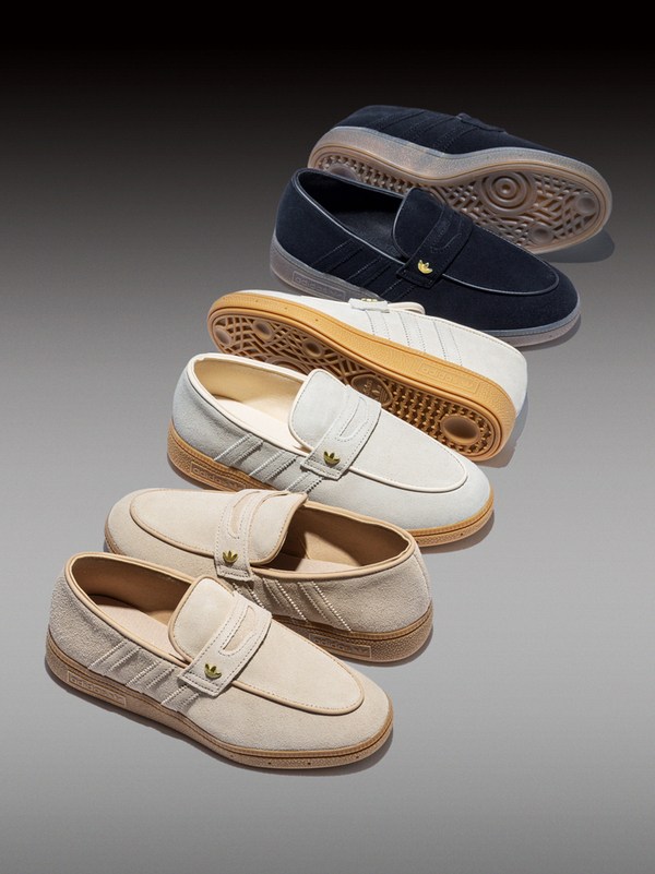A collection of various casual loafer-style shoes in different colors, including navy blue, beige, and white, with contrasting soles and details.