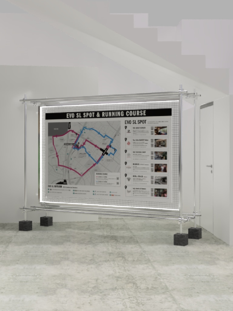 A large display board showing a map and information about an end-of-season spot and running course, situated in a plain indoor setting with a tiled floor.