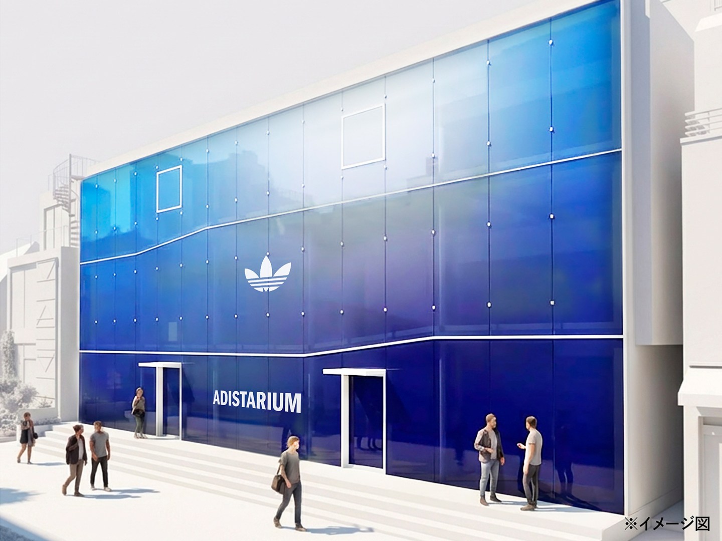 A large blue and white building with the Adidas logo prominently displayed, with several people standing in the foreground.