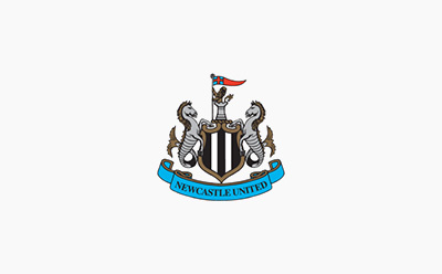 The image depicts a coat of arms or heraldic emblem featuring a shield with a black and white design, flanked by two horses or seahorses, and a flag or banner with the text "Newcastle United" below.