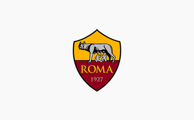 The image depicts the crest or logo of the Italian football club A.S. Roma, featuring a wolf suckling two infants, set against a yellow and red shield-shaped background.