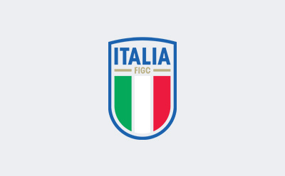 The image depicts the logo of the Italian Football Federation (FIGC), featuring the Italian flag colors and the text "ITALIA FIGC" on a shield-shaped emblem.