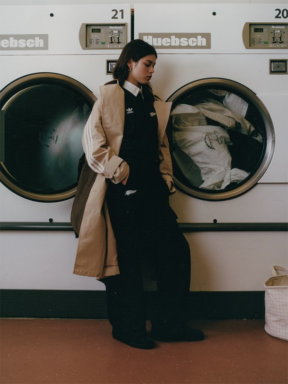 Female model wearing new zealand originals in an old school laundry