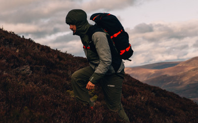 Male hikes wearing layers from the Terrex Adventure Wardrobe FW24 Collection
