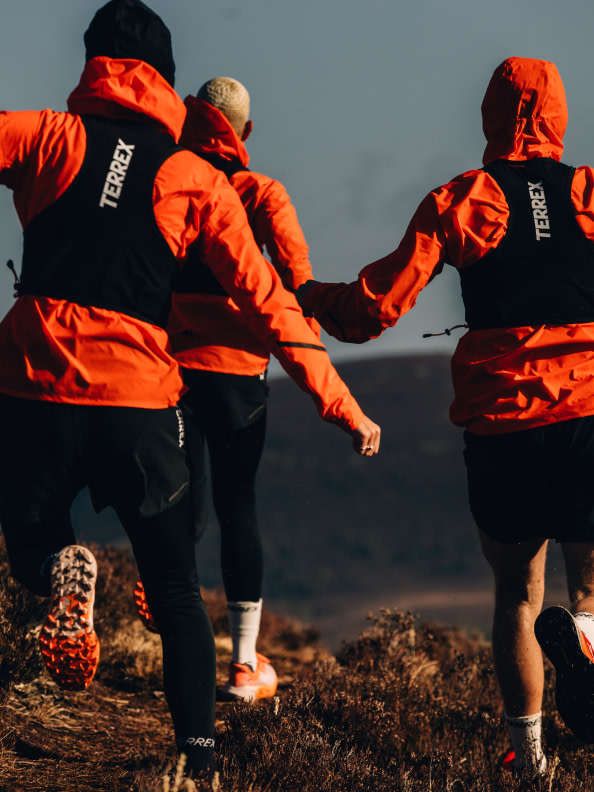 A group of runners, on a trail run wearing the Terrex Agravic 3 and other items from the Terrex Adventure Wardrobe FW24 collection
