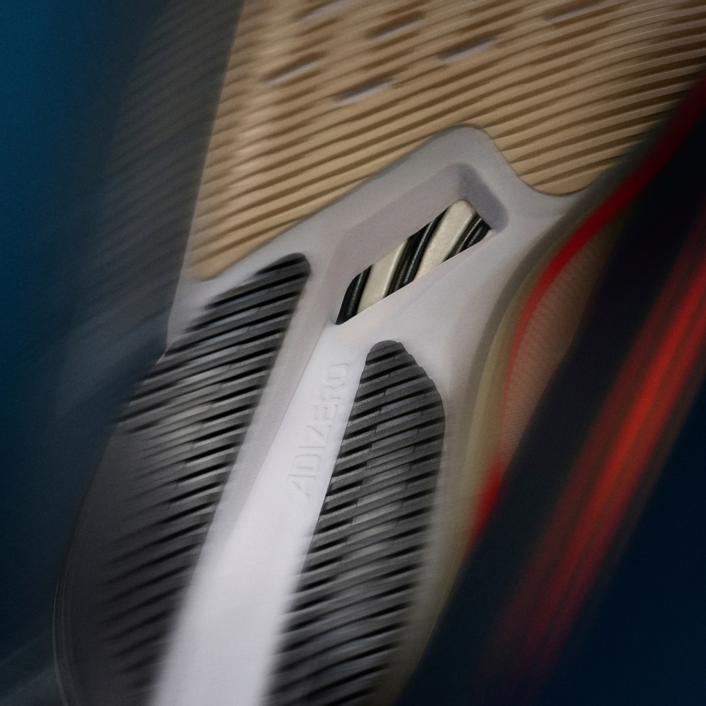 A close up of the new Adizero Boston 12 midsole, showing the ENERGYRODS 2.0 that boost your performance.