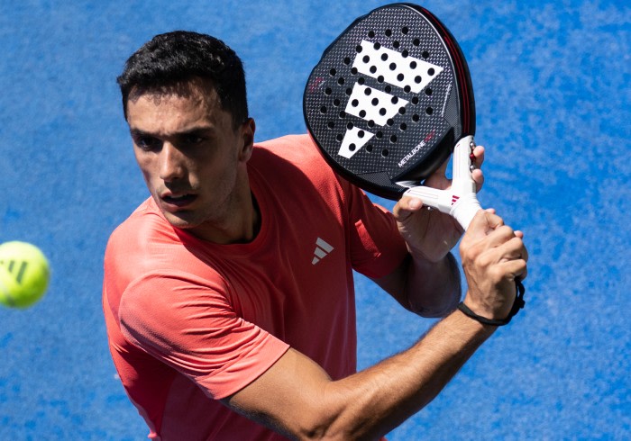 A man wearing the new adidas padel gear and playing padel.